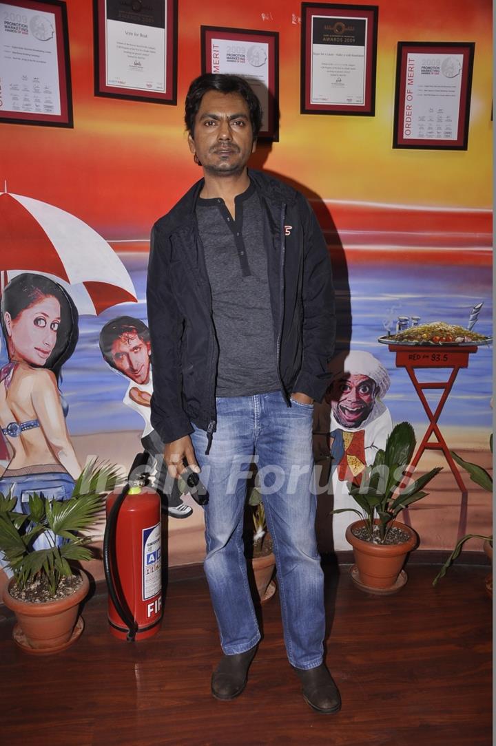 Nawazuddin Siddiqui poses for the media at the Promotions of Badlapur on 93.5 Red FM