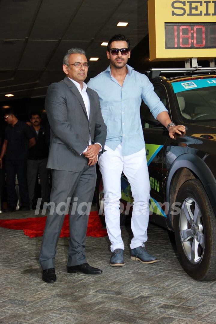 John Abraham poses with an official at SCMM Marathon Meet