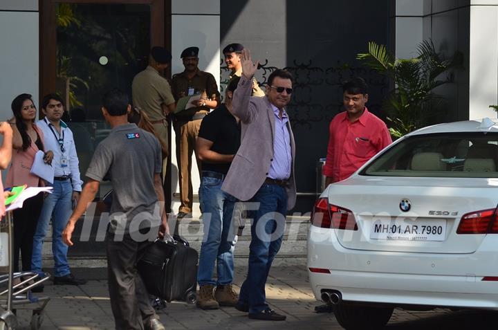 Boman Irani waves out to the cameras at the Airport