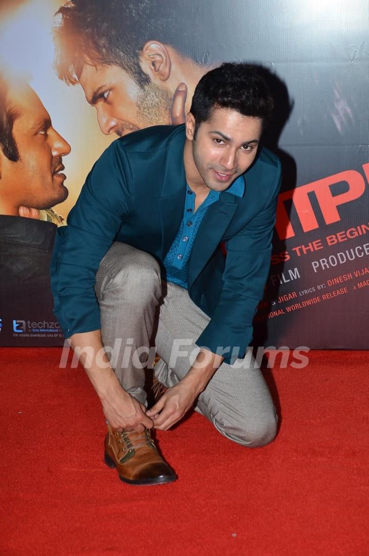 Varun Dhawan ties his shoe lace at the Music Launch of Badlapur