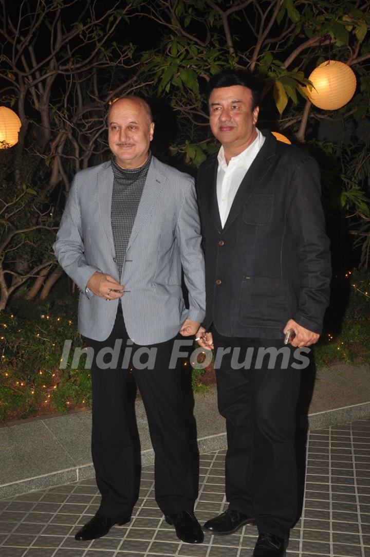 Anupam Kher and Anu Malik pose for the media at Farah Khan's Birthday Bash