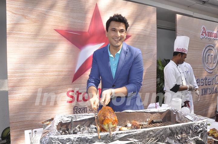 Vikas Khanna prepares a dish at the Launch of Master Chef Season 4