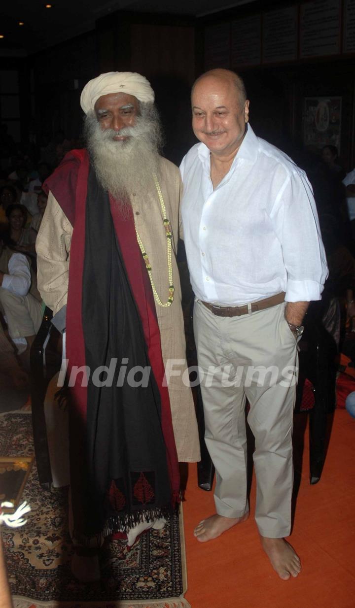 Anupam Kher poses with Sadhguru at the release of the DVD 'Acting to Awakening'