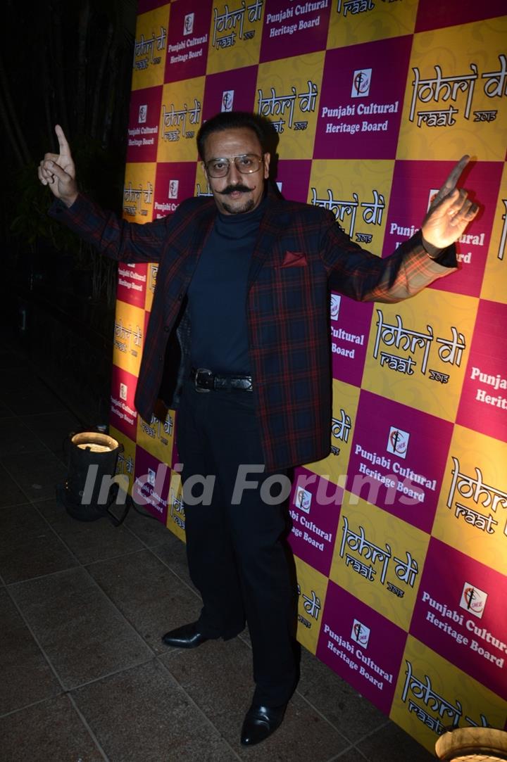 Gulshan Grover poses for the media at Charan Singh's Lohri Celebration