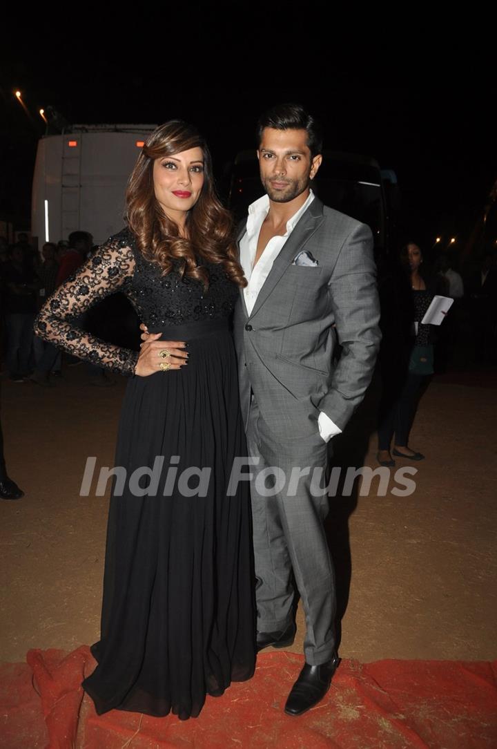 Bipasha Basu and Karan Singh Grover pose for the media at Umang Police Show