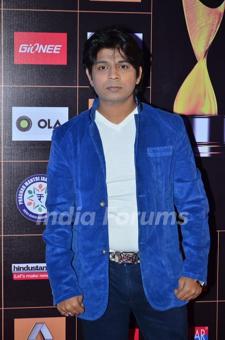 Ankit Tiwari poses for the media at Star Guild Awards