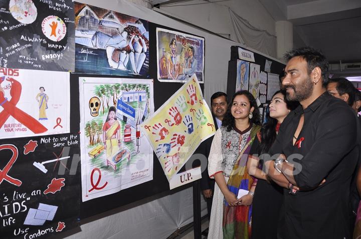 Ajay Devgn checks through the posters at National Youth Day Event