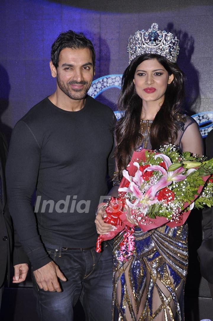 John Abraham poses with the winner at the Launch of Yamaha Fascino Calendar