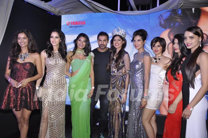 John Abraham poses with models at the Launch of Yamaha Fascino Calendar