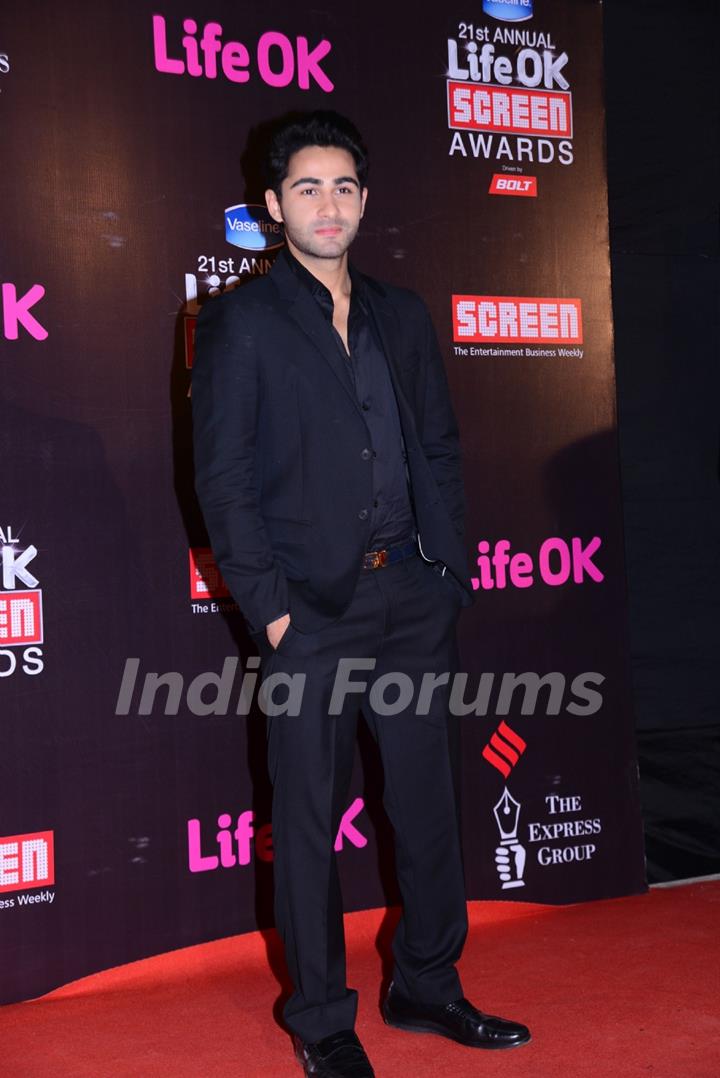 Armaan Jain poses for the media at 21st Annual Life OK Screen Awards Red Carpet