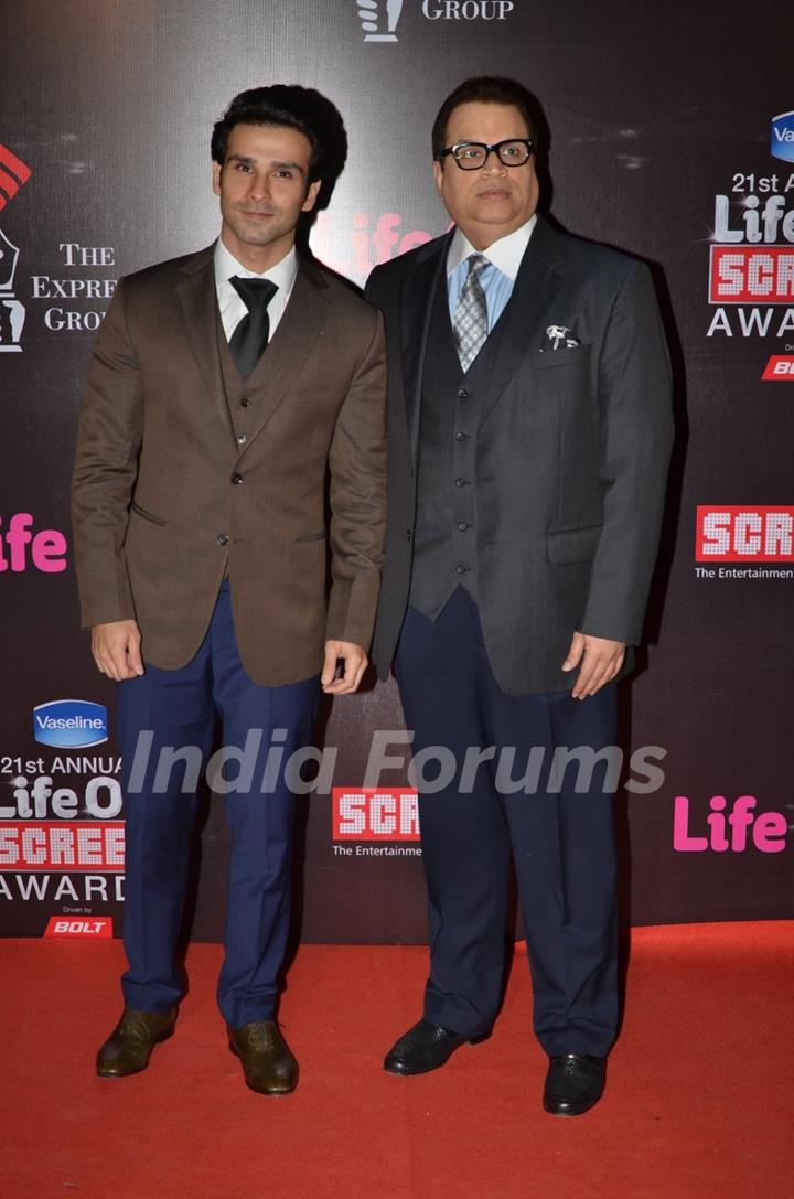 Girish Kumar and Ramesh Taurani pose for the media at 21st Annual Life OK Screen Awards Red Carpet
