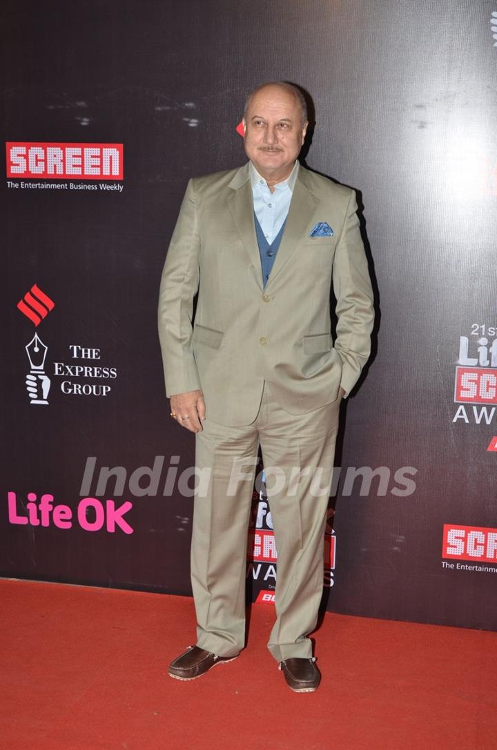 Anupam Kher poses for the media at 21st Annual Life OK Screen Awards Red Carpet