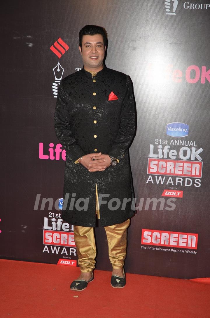 Varun Sharma poses for the media at 21st Annual Life OK Screen Awards Red Carpet