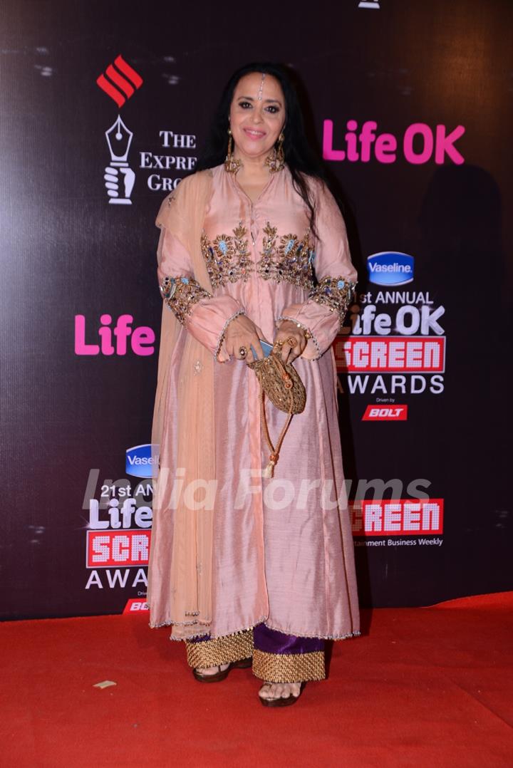 Ila Arun poses for the media at 21st Annual Life OK Screen Awards Red Carpet