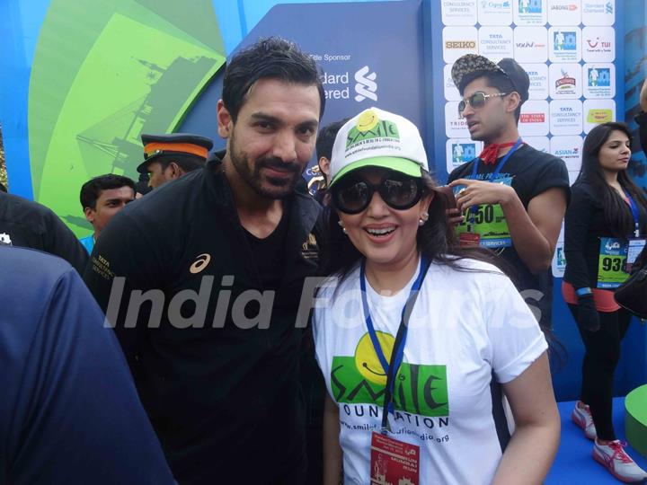 John Abraham and Archana Kochhar pose for the media at Standard Chartered Mumbai Marathon 2015