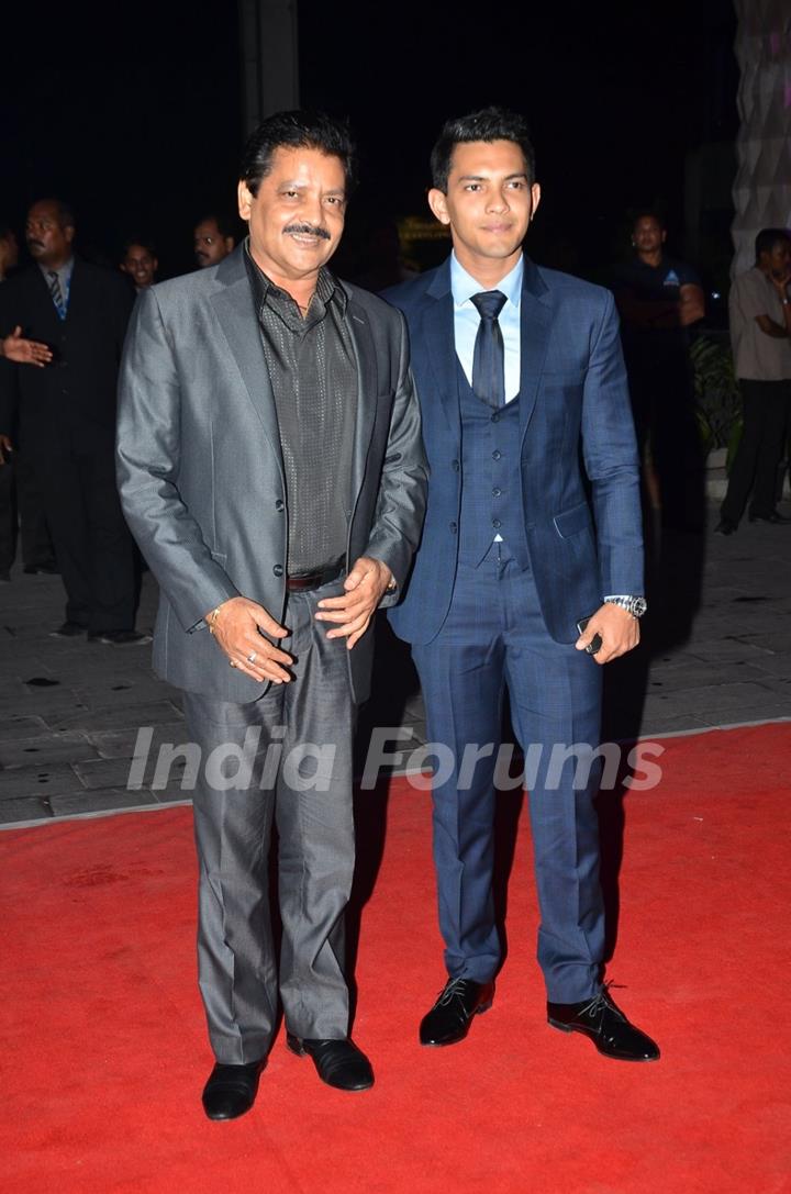 Udit Narayan and Aditya Narayan pose for the media at Kush Sinha's Wedding Reception