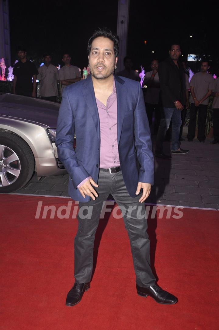 Mika Singh poses for the media at Kush Sinha's Wedding Reception