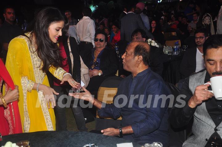 Aishwarya Rai Bachchan was snapped greeting Rajinikanth at the Music Launch of Shamitabh