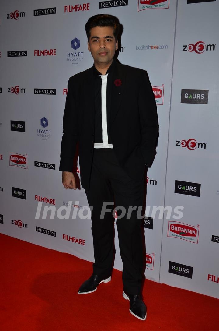 Karan Johar poses for the media at Filmfare Nominations Bash