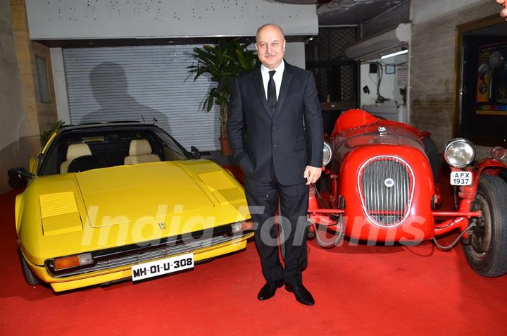 Anupam Kher poses for the media at the Red Carpet Premier of Baby