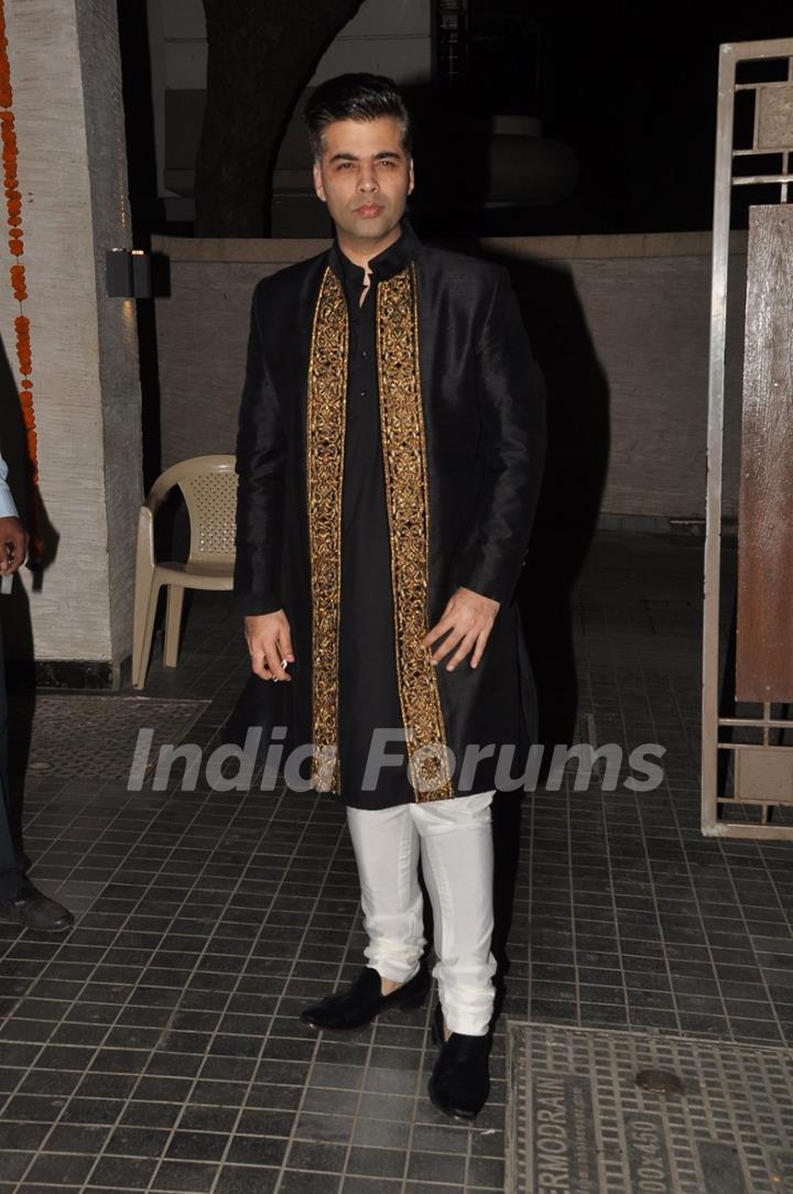 Karan Johar poses for the media at Soha Ali Khan and Kunal Khemu's Wedding Reception