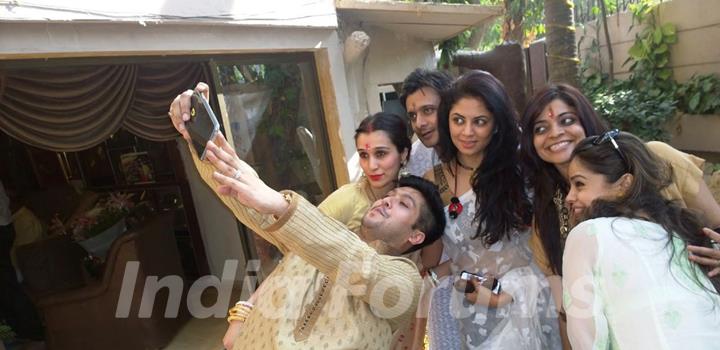 Bappa Lahiri clicks a selfie with friends at his Saraswati Pooja