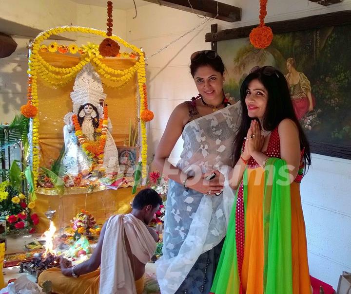 Kavita Kaushik and Sumona Chakravarti pose for the media at Bappi Lahiri's Saraswati Pooja