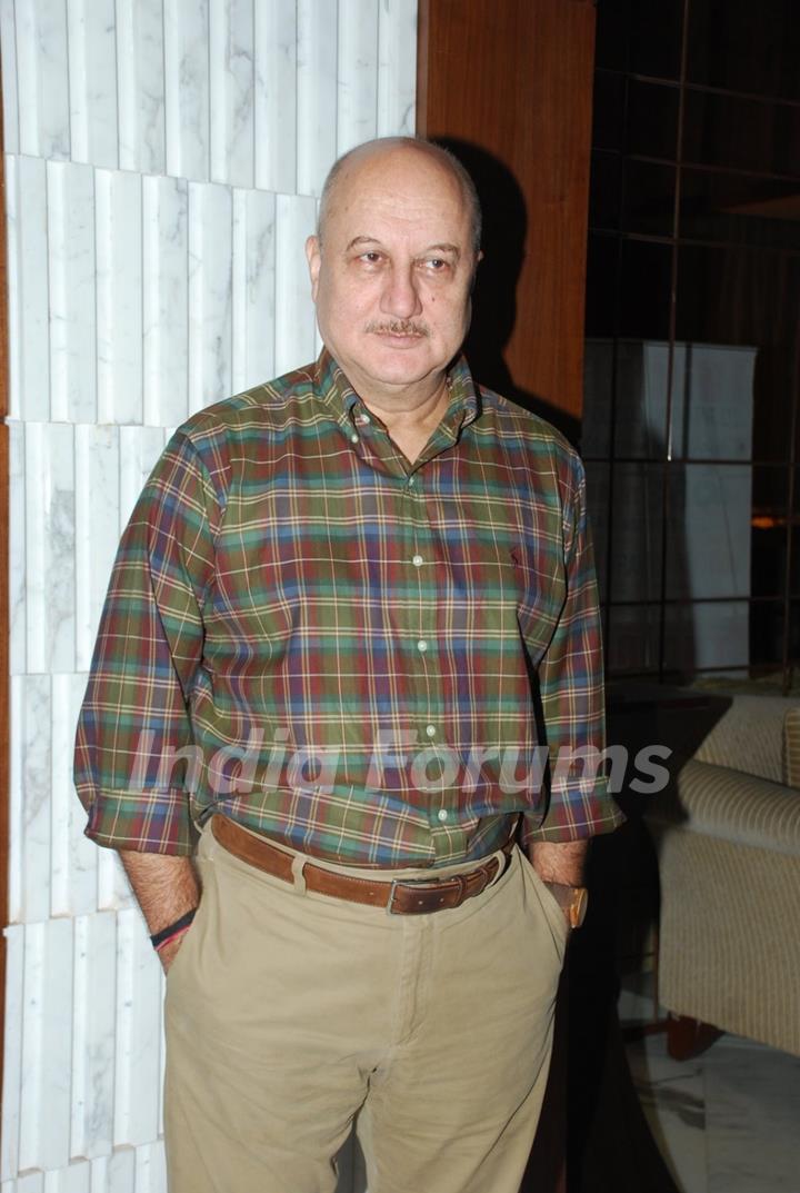 Anupam Kher poses for the media at Arya Babbar's Book Launch