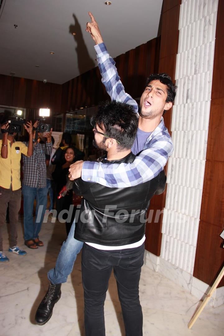 Arya Babbar and Prateik Babbar pose for the media at the Book Launch