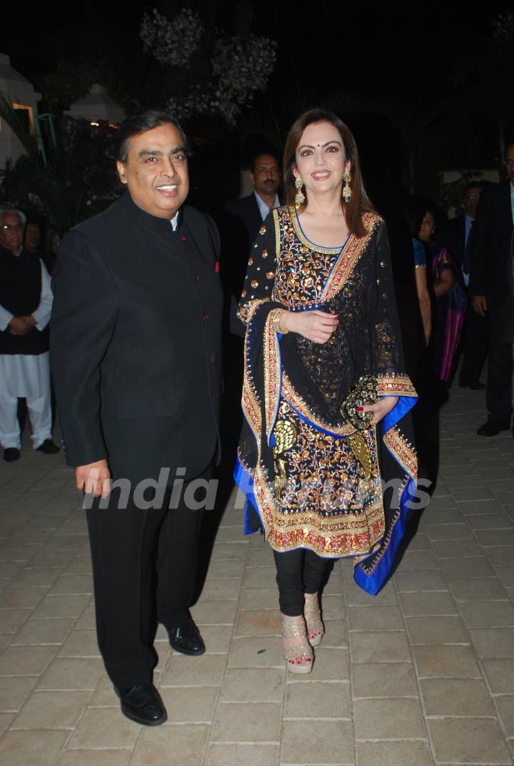 Mukesh Ambani and Nita Ambani pose for the media at Hinduja Bash