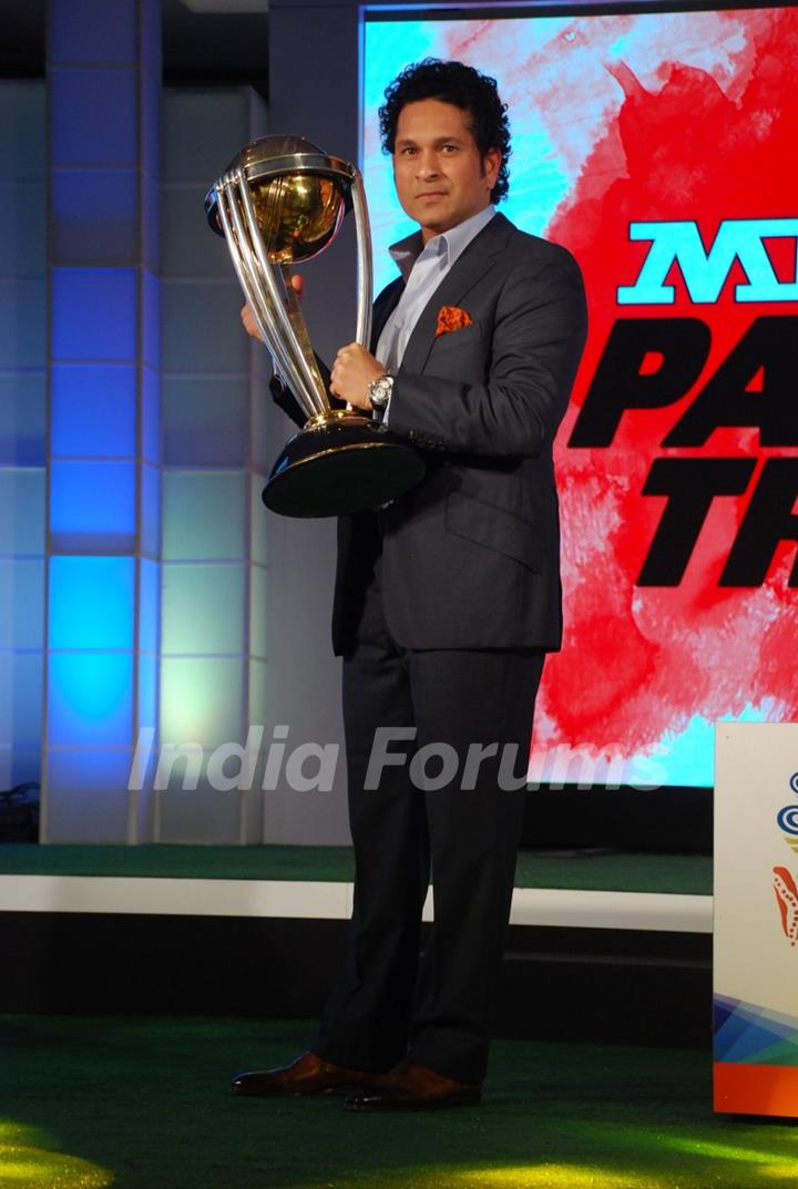 Sachin Tendulkar poses with the trophy at MRF Promotions