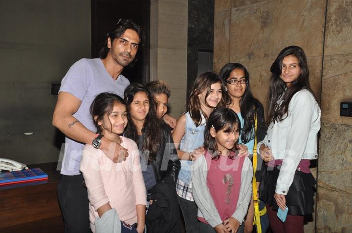 Arjun Rampal poses with children at the Special Screening of Roy