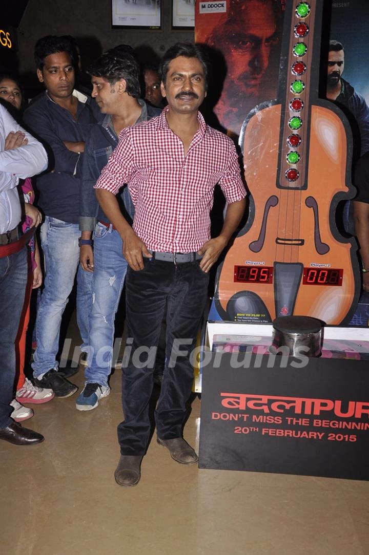 Nawazuddin Siddiqui poses for the media at the Promotions of Badlapur