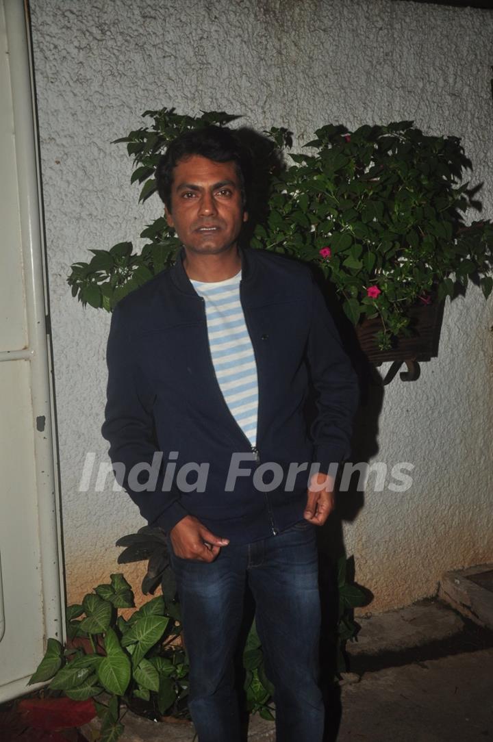 Nawazuddin Siddiqui poses for the media at the Special Screening of Badlapur