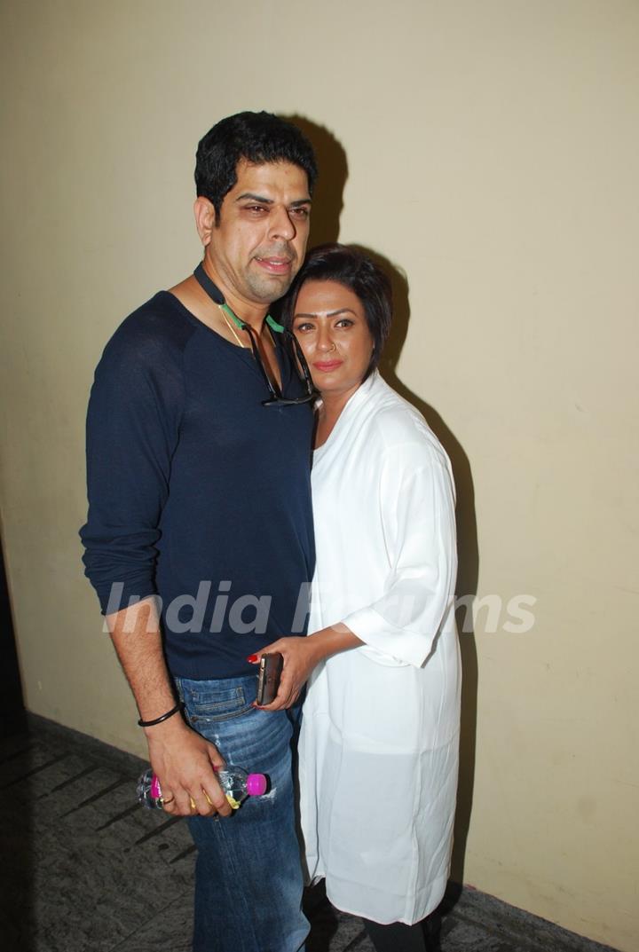 Murli Sharma and Ashwini Kalsekar pose for the media at the Special Screening of Badlapur