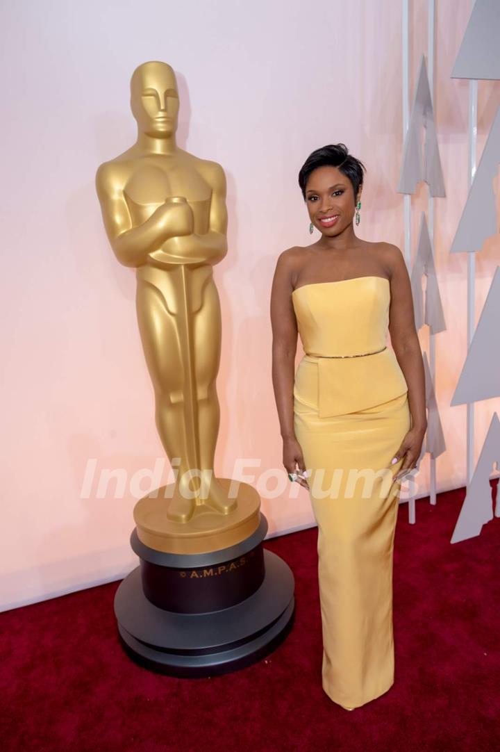 Jennifer Hudson poses for the media at the Oscars Red Carpet 2015