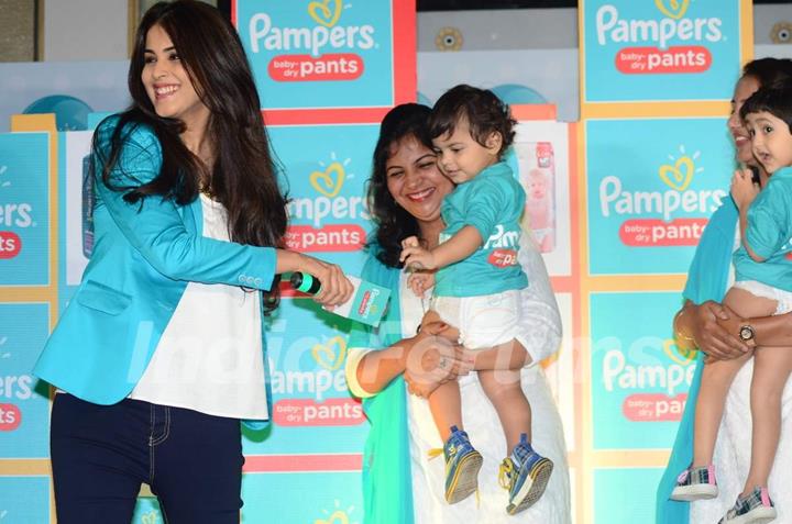 Genelia Dsouza plays with the babies at Pampers Press Meet