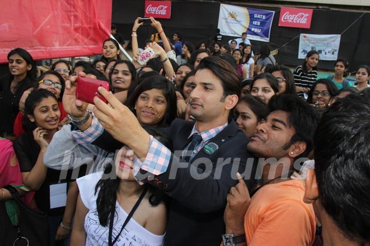 Sushant Singh Rajput clicks a selfie with fans at the Fashion Show