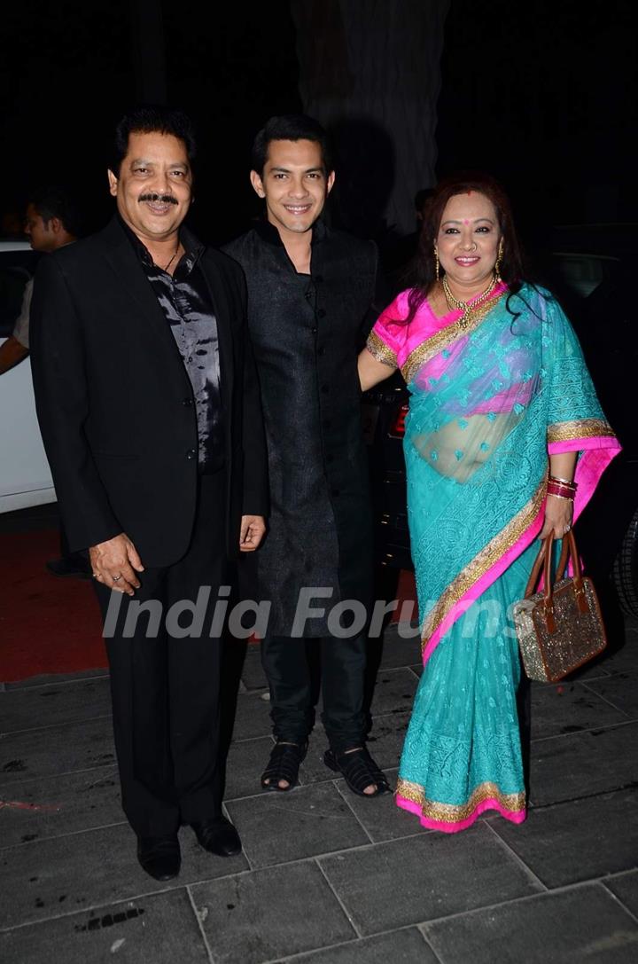 Aditya Narayan poses with his Parents at Tulsi Kumar's Wedding Reception