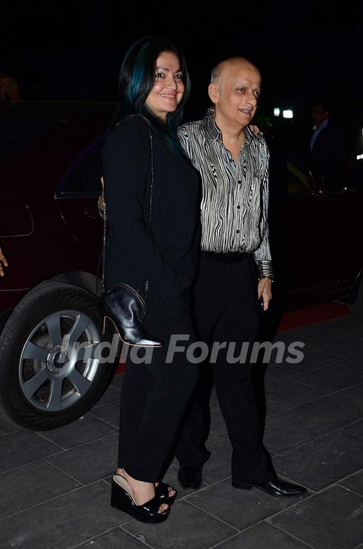 Pooja Bhatt and Mukesh Bhatt pose for the media at Tulsi Kumar's Wedding Reception