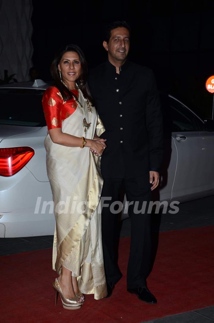 Sulaiman Merchant poses with wife at Tulsi Kumar's Wedding Reception