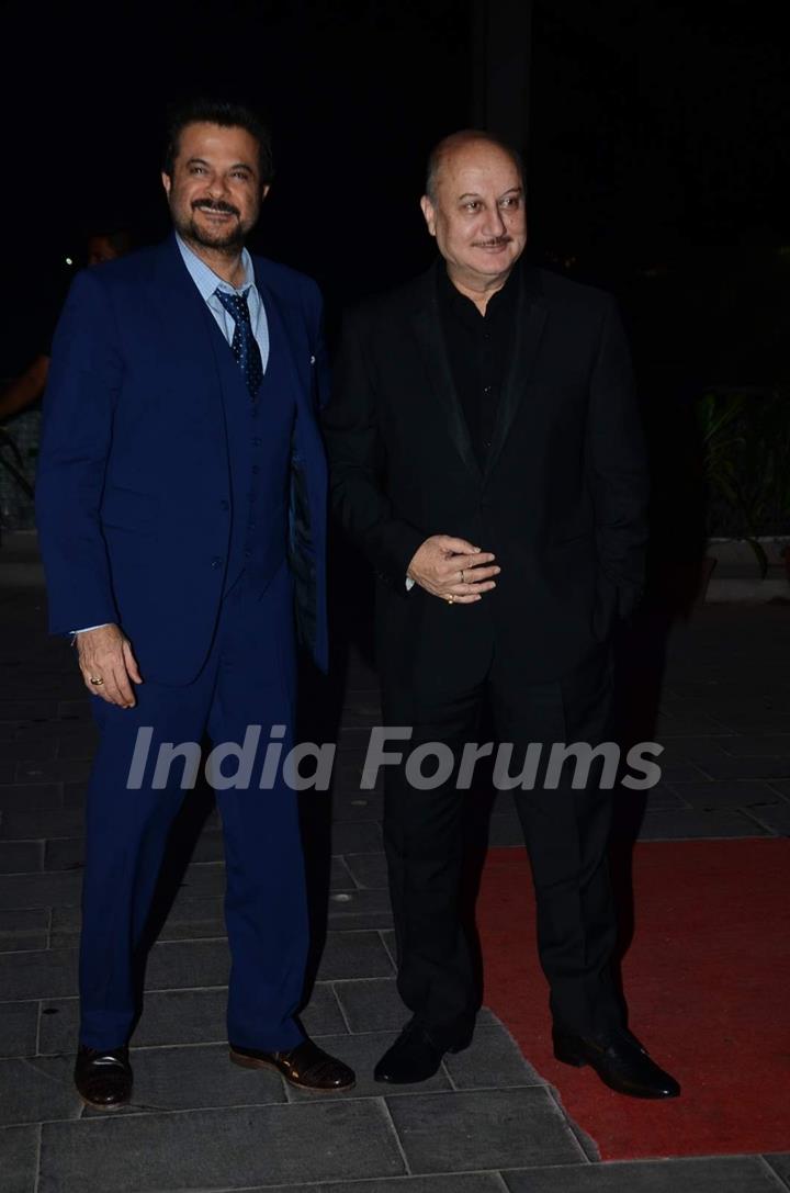 Anil Kapoor and Anupam Kher pose for the media at Tulsi Kumar's Wedding Reception