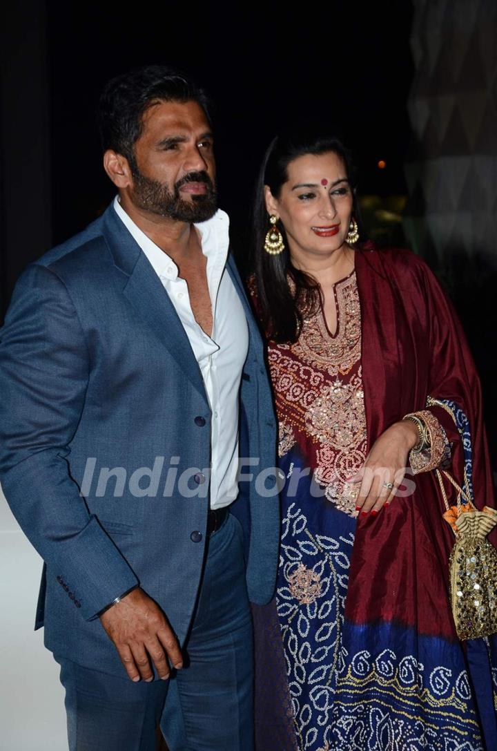 Suniel Shetty and Mana Shetty pose for the media at Tulsi Kumar's Wedding Reception