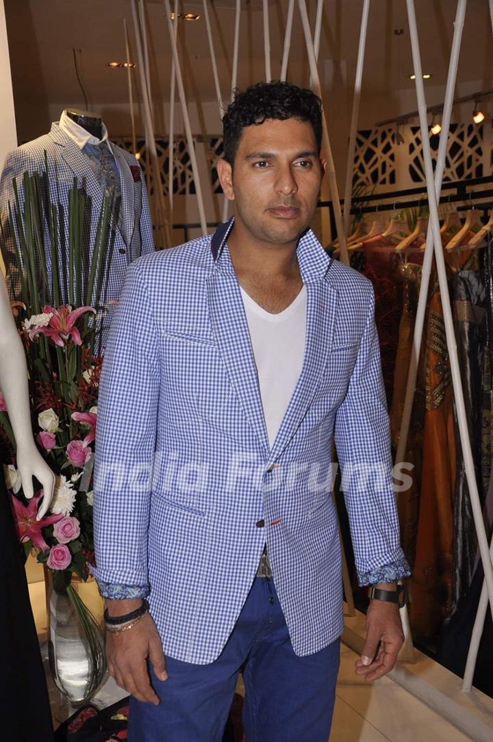 Yuvraj Singh poses for the media at Narendra Kumar's Store Launch