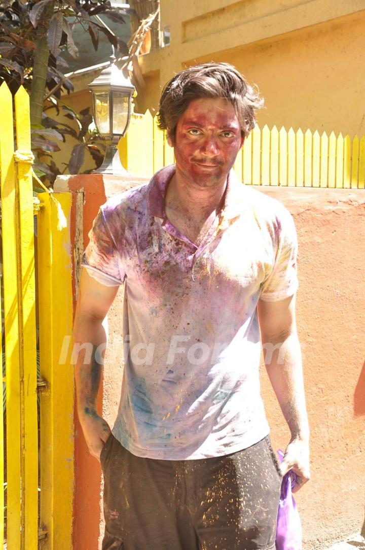 Ali Fazal poses for the media at Shabana Azmi's Holi Bash