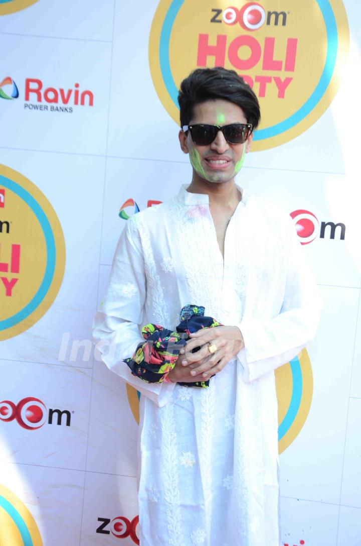 Sushant Divgikar poses for the media at Zoom Holi Bash