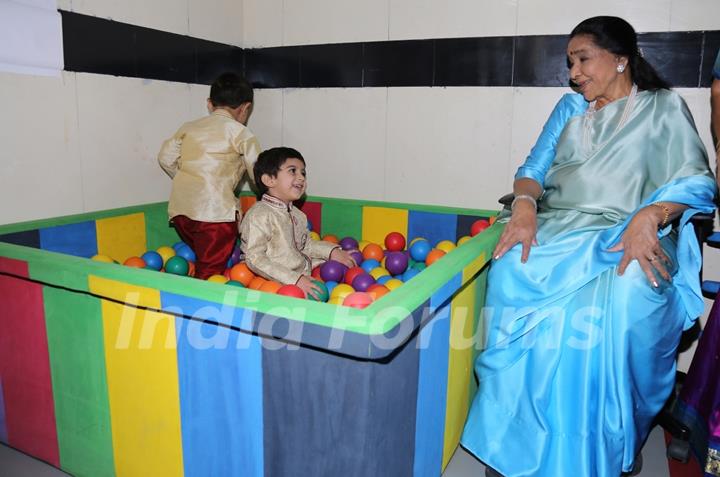 Asha Bhosle plays with the kids at the Inauguration