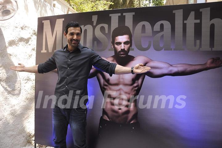 John Abraham poses for the media at the Launch of Men's Health March Edition
