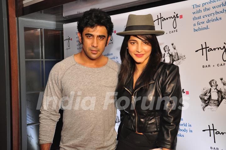 Amit Sadh and Shruti Hassan pose for the media at the Launch of Harry's Bar & Cafe