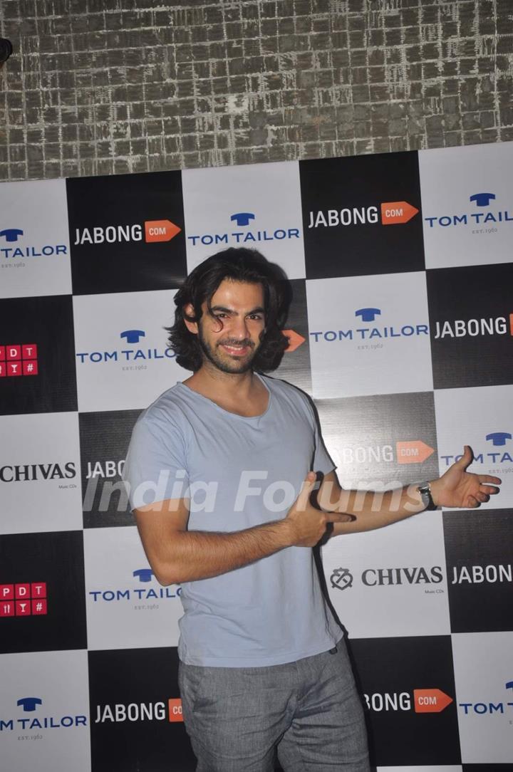 Karan V Grover poses for the media at Tom Tailor and Jabong Bash